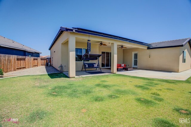 802 Barre Ct, Bakersfield, CA 93314 - rear view of house featuring ceiling fan, stucco siding, and a patio area