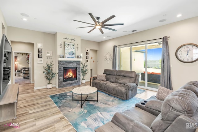 802 Barre Ct, Bakersfield, CA 93314 - living area featuring wood finished floors, a ceiling fan, a fireplace, and recessed lighting