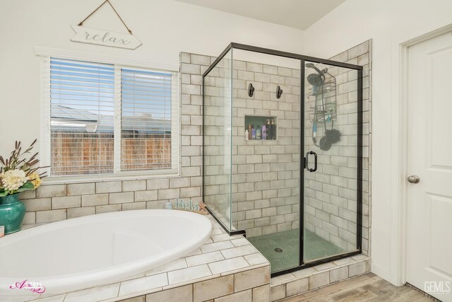 802 Barre Ct, Bakersfield, CA 93314 - bathroom featuring a garden tub, a shower stall, and wood finished floors