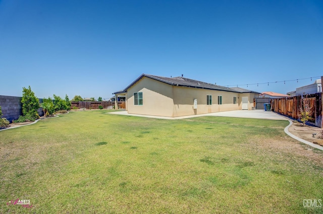 802 Barre Ct, Bakersfield, CA 93314 - rear view of property with a fenced backyard, stucco siding, and a patio area