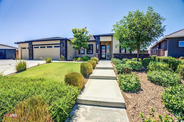 802 Barre Ct, Bakersfield, CA 93314 - view of front of house with stone siding, an attached garage, and concrete driveway