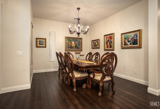dining room featuring an inviting chandelier, wood finished floors, and baseboards
