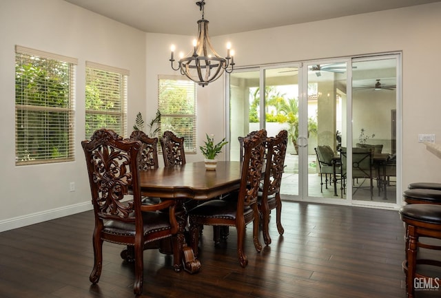 dining room featuring hardwood / wood-style flooring, baseboards, and ceiling fan with notable chandelier