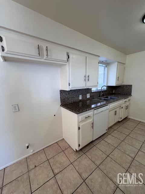 kitchen with white cabinetry, sink, tasteful backsplash, and dishwasher