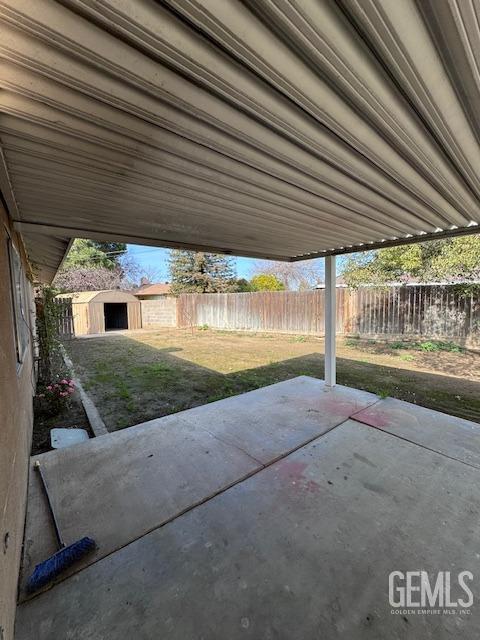 view of patio / terrace with a storage shed