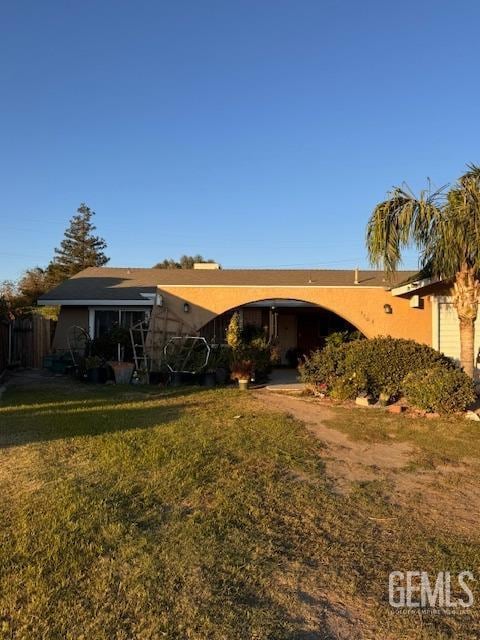 rear view of property with a yard