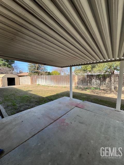 view of patio with a shed