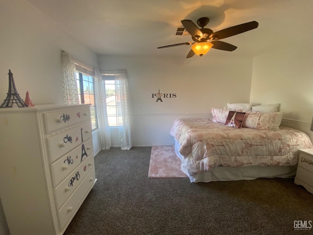 bedroom with dark carpet and ceiling fan