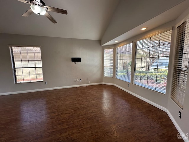 unfurnished room with dark hardwood / wood-style flooring, ceiling fan, and lofted ceiling