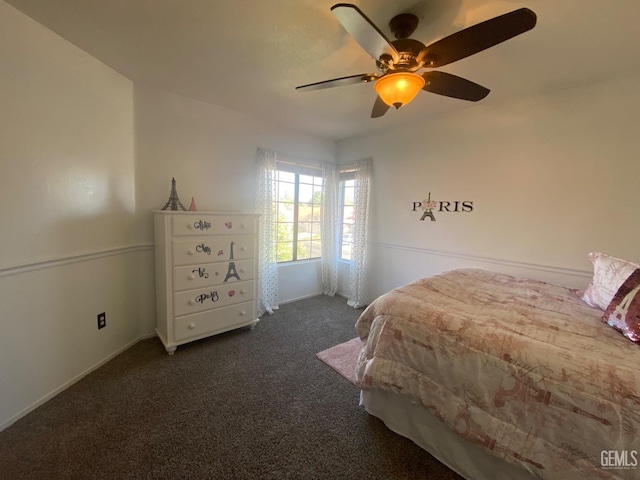 bedroom with ceiling fan and dark carpet