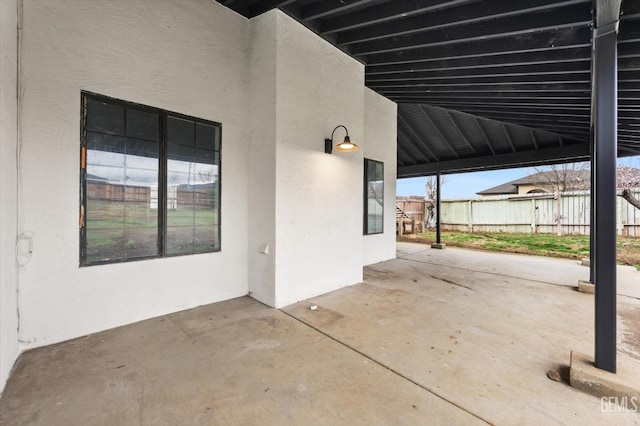 view of patio featuring fence