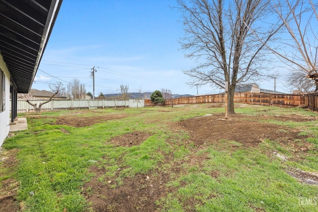 view of yard with a fenced backyard