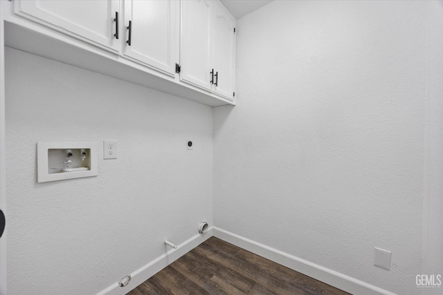 clothes washing area with electric dryer hookup, washer hookup, cabinet space, baseboards, and gas dryer hookup