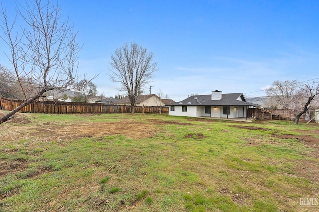 view of yard featuring a patio and a fenced backyard