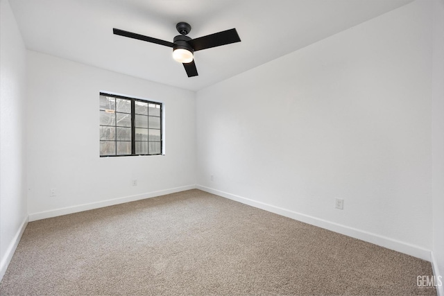 empty room with baseboards, carpet floors, and ceiling fan