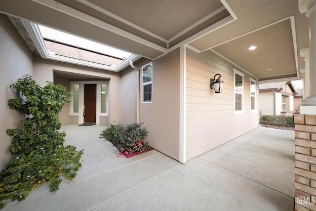 property entrance featuring a patio