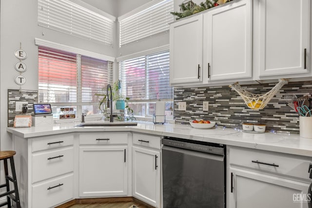 5000 Rogue Water Ct, Bakersfield, CA 93313 - kitchen with dishwasher, decorative backsplash, and white cabinets
