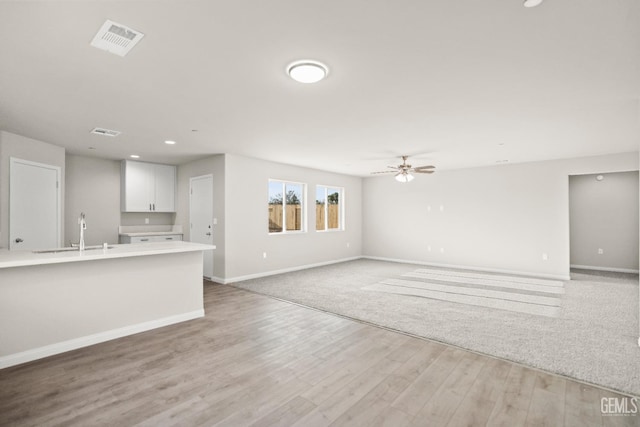 618 Poinsettia St, Bakersfield, CA 93307 - unfurnished living room featuring ceiling fan, light wood-style floors, and recessed lighting