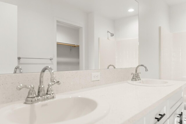 618 Poinsettia St, Bakersfield, CA 93307 - full bathroom with double vanity, recessed lighting, and a spacious closet