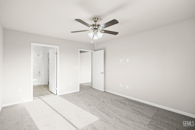 618 Poinsettia St, Bakersfield, CA 93307 - unfurnished bedroom with light carpet, connected bathroom, and a ceiling fan