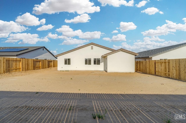 618 Poinsettia St, Bakersfield, CA 93307 - back of house featuring stucco siding and a fenced backyard