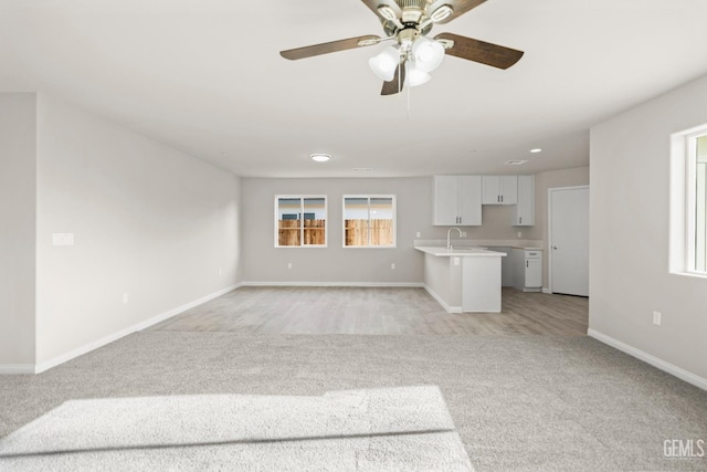 618 Poinsettia St, Bakersfield, CA 93307 - unfurnished living room with light carpet and ceiling fan