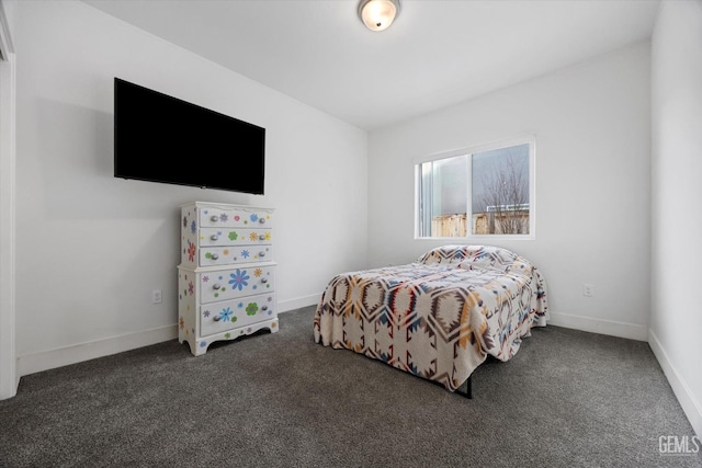 bedroom featuring carpet flooring and baseboards