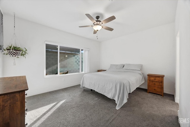 bedroom featuring baseboards, ceiling fan, and carpet flooring