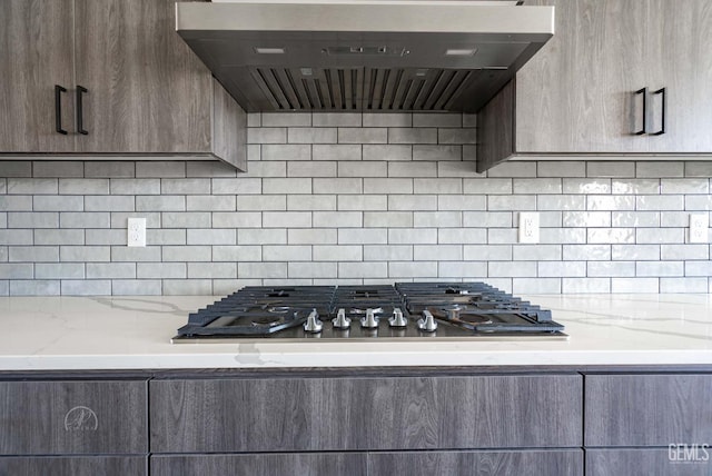 1215 Brookline Ln, Bakersfield, CA 93314 - kitchen featuring exhaust hood, gas stovetop, decorative backsplash, and light stone counters