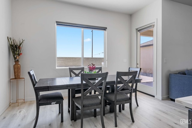 1215 Brookline Ln, Bakersfield, CA 93314 - dining space with light wood-style flooring and baseboards