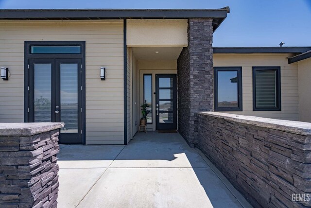 1215 Brookline Ln, Bakersfield, CA 93314 - property entrance with french doors and a patio area