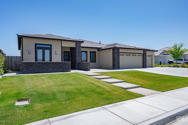 1215 Brookline Ln, Bakersfield, CA 93314 - prairie-style home featuring stone siding, concrete driveway, and an attached garage