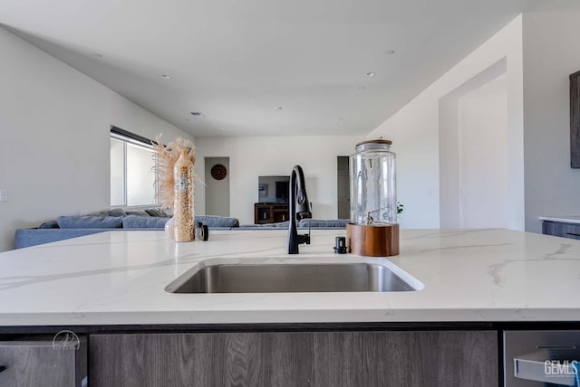1215 Brookline Ln, Bakersfield, CA 93314 - kitchen featuring open floor plan, a sink, and light stone countertops