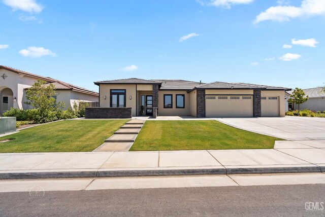 1215 Brookline Ln, Bakersfield, CA 93314 - prairie-style house with an attached garage, concrete driveway, and a front yard
