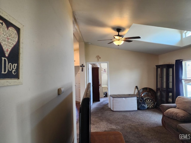 carpeted living room with lofted ceiling and ceiling fan