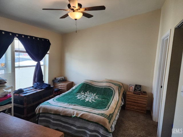 carpeted bedroom with ceiling fan