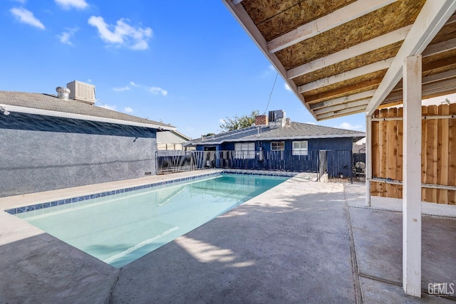 view of pool featuring a patio area and central AC