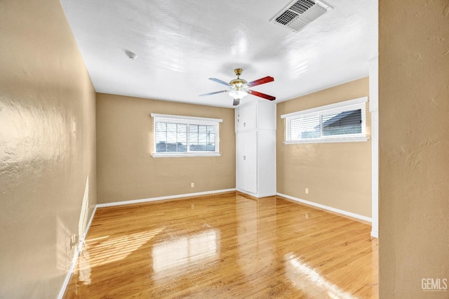 spare room featuring light wood-type flooring