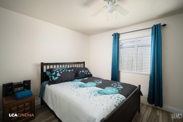 1109 Bell Ave, Taft, CA 93268 - bedroom featuring wood finished floors, baseboards, and a ceiling fan