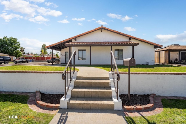 1109 Bell Ave, Taft, CA 93268 - view of front facade with a tile roof and stucco siding