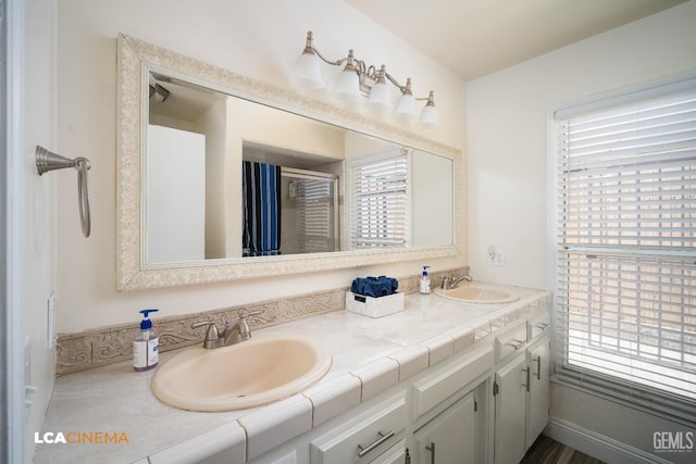 1109 Bell Ave, Taft, CA 93268 - bathroom with double vanity and an enclosed shower