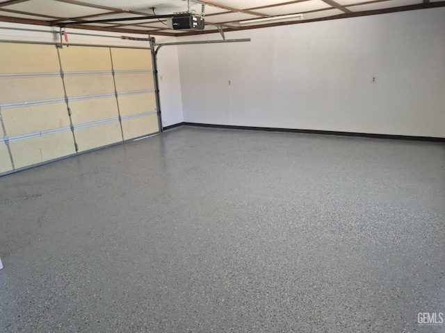 1109 Bell Ave, Taft, CA 93268 - garage with a garage door opener and baseboards