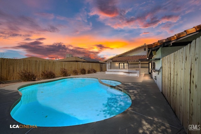 1109 Bell Ave, Taft, CA 93268 - view of swimming pool featuring a patio area, a fenced backyard, and a pool with connected hot tub