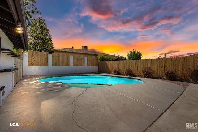1109 Bell Ave, Taft, CA 93268 - view of pool featuring a patio area, a fenced backyard, and a pool with connected hot tub