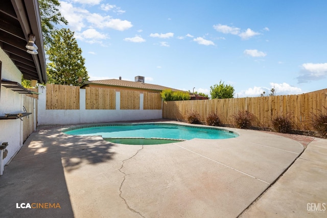1109 Bell Ave, Taft, CA 93268 - view of swimming pool with a patio area, a fenced backyard, and a pool with connected hot tub
