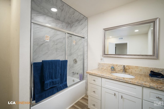 1109 Bell Ave, Taft, CA 93268 - bathroom with vanity, bath / shower combo with glass door, wood finished floors, and recessed lighting