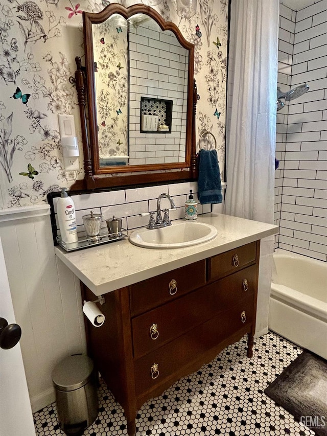 bathroom with shower / bath combo with shower curtain and vanity