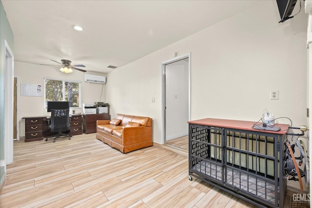 253 E Mckee Rd, Bakersfield, CA 93307 - home office with a wall unit AC, a ceiling fan, and light wood-style flooring
