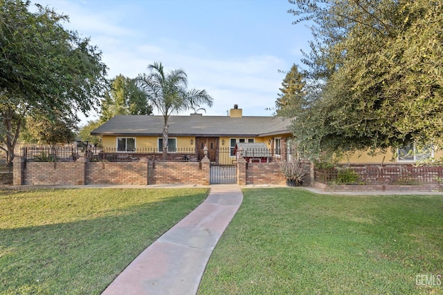 253 E Mckee Rd, Bakersfield, CA 93307 - single story home with brick siding, a gate, a fenced front yard, and a chimney
