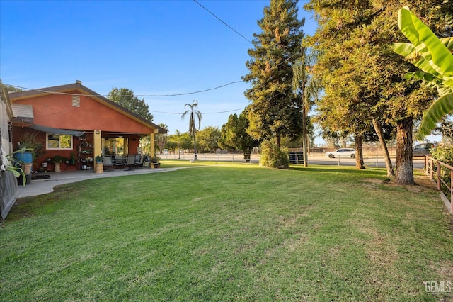 253 E Mckee Rd, Bakersfield, CA 93307 - view of yard featuring a patio